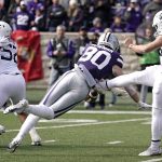 
              Kansas State wide receiver Ty Bowman (80) blocks a punt by West Virginia place kicker Danny King (39) during the first half of an NCAA college football game, Saturday, Nov. 13, 2021, in Manhattan, Kan. (AP Photo/Charlie Riedel)
            