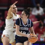 
              Villanova's Brianna Herlihy, right, is pressured by Maryland's Chloe Bibby during the first half of an NCAA college basketball game on Friday, Nov. 12, 2021, in College Park, Md. (AP Photo/Gail Burton)
            