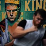 
              Unified WBC/WBO/WBA super middleweight champion Canelo Alvarez trains in front of an image of himself at a gym Wednesday, Oct. 20, 2021, in San Diego. Alvarez faces undefeated IBF Super Middleweight Champion Caleb Plant in a fight Nov. 6 in Las Vegas. (AP Photo/Gregory Bull)
            