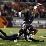 
              Oregon State running back B.J. Baylor (4) is upended by Arizona State defensive back Jack Jones (0) during the second quarter of an NCAA college football game Saturday, Nov. 20, 2021, in Corvallis, Ore. (AP Photo/Andy Nelson)
            