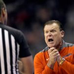 
              Illinois head coach Brad Underwood talks to an official during the first half of an NCAA college basketball game against Cincinnati Monday, Nov. 22, 2021, in Kansas City, Mo. (AP Photo/Charlie Riedel)
            