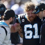 
              Carolina Panthers center Matt Paradis is helped off the field during the first half of an NFL football game against the New England Patriots Sunday, Nov. 7, 2021, in Charlotte, N.C. (AP Photo/John Bazemore)
            
