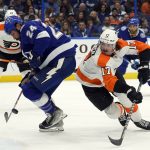 
              Tampa Bay Lightning defenseman Zach Bogosian (24) steals the puck from Philadelphia Flyers center Zack MacEwen (17) during the first period of an NHL hockey game Tuesday, Nov. 23, 2021, in Tampa, Fla. (AP Photo/Chris O'Meara)
            