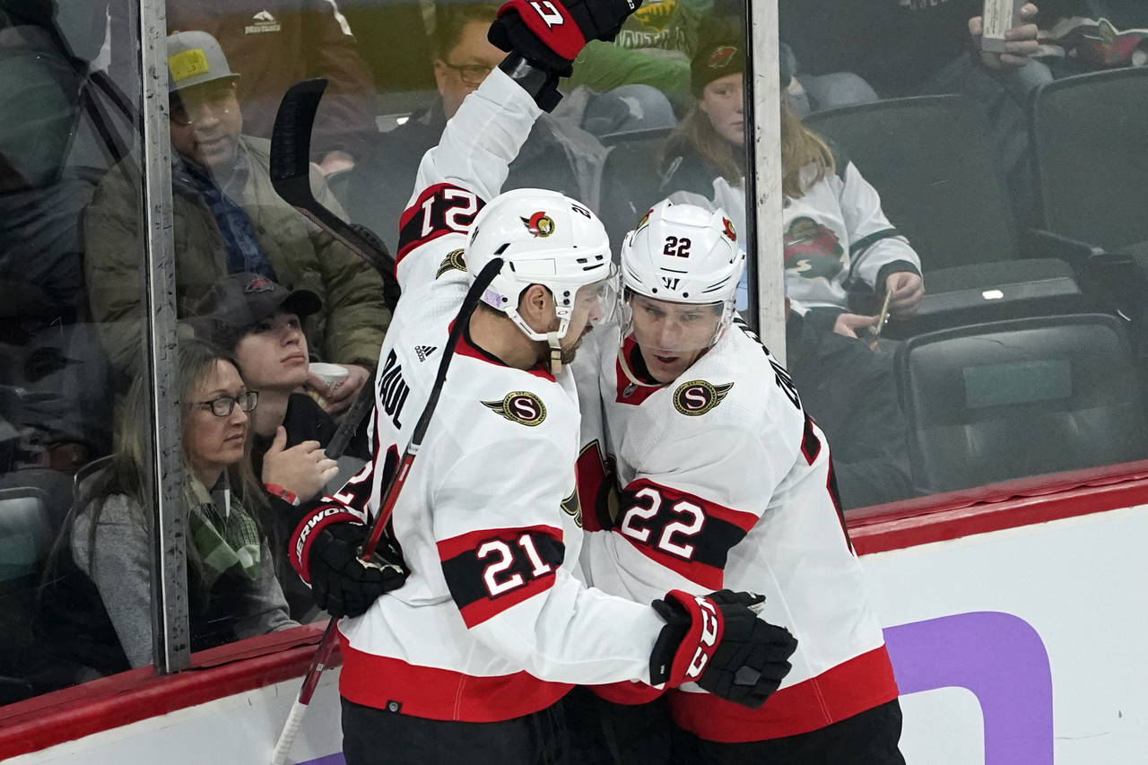 Ottawa Senators' Nick Paul, left, and Nikita Zaitsev celebrate Paul's goal against Minnesota Wild g...