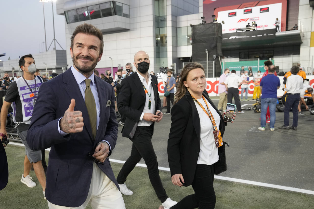 Former England's soccer superstar David Beckham gives a thumbs-up before the Qatar Formula One Gran...