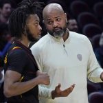 
              Cleveland Cavaliers head coach J.B Bickerstaff, right, talks with Darius Garland during the second half of the team's NBA basketball game against the Brooklyn Nets, Monday, Nov. 22, 2021, in Cleveland. (AP Photo/Tony Dejak)
            
