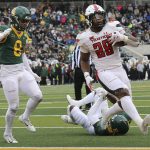 
              Texas Tech running back Tahj Brooks scores a touchdown past Baylor safety Jalen Pitre in the first half of an NCAA college football game Saturday, Nov. 27, 2021, in Waco, Texas. (AP Photo/Jerry Larson)
            
