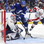 
              Washington Capitals goaltender Vitek Vanecek, of Czech Republic, makes a save against Tampa Bay Lightning's Pat Maroon as Lars Eller, of Denmark, defends during the second period of an NHL hockey game Monday, Nov. 1, 2021, in Tampa, Fla. (AP Photo/Mike Carlson)
            