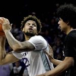 
              Kansas State's Davion Bradford, left, looks to pass around Omaha's Isaiah Pooh-Bear Chandler (44) during the first half of an NCAA college basketball game Wednesday, Nov. 17, 2021, in Manhattan, Kan. (AP Photo/Charlie Riedel)
            