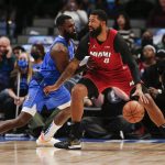 
              Miami Heat forward Markieff Morris (8) is defended by Dallas Mavericks forward Tim Hardaway Jr. during the first half of an NBA basketball game Tuesday, Nov. 2, 2021, in Dallas. (AP Photo/Brandon Wade)
            