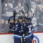 
              Winnipeg Jets' Josh Morrissey (44) and Kyle Connor (81) celebrate Connor's goal during the second period of an NHL hockey game Friday, Nov. 5, 2021, in Winnipeg, Manitoba. (John Woods/The Canadian Press via AP)
            