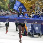 
              FILE - Lelisa Desisa, of Ethiopia, crosses the finish line first in the men's division of the New York City Marathon, Nov. 4, 2018. A limited field of 33,000 runners will jog off the Verrazzano Bridge and wind its way toward Central Park on Sunday as the New York City Marathon returns for its 50th edition after being wiped out in 2020 by the coronavirus pandemic. (AP Photo/Seth Wenig, File)
            