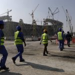 
              FILE - Workers walk to the Lusail Stadium, one of the 2022 World Cup stadiums, in Lusail, Qatar, Friday, Dec. 20, 2019. The eight stadiums for the World Cup, all within a 30-mile radius of Doha, are now largely complete. (AP Photo/Hassan Ammar, File)
            
