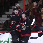 
              Ottawa Senators' Zach Sanford (13) celebrates with Thomas Chabot (72) after scoring against the Pittsburgh Penguins during the second period of an NHL hockey game in Ottawa, on Saturday, Nov. 13, 2021. (Justin Tang/The Canadian Press via AP)
            