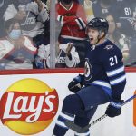 
              Winnipeg Jets' Dominic Toninato (21) celebrates his goal against the Chicago Blackhawks during the second period of an NHL hockey game Friday, Nov. 5, 2021, in Winnipeg, Manitoba. (John Woods/The Canadian Press via AP)
            