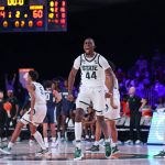 
              Michigan State forward Gabe Brown (44) and teammates celebrate after defeating Connecticut 64-60  in an NCAA college basketball game against Baylor at Paradise Island, Bahamas, Thursday, Nov. 25, 2021. (Tim Aylen/Bahamas Visual Services via AP)
            