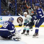 
              Tampa Bay Lightning goaltender Andrei Vasilevskiy (88) makes a save on a shot by Seattle Kraken right wing Jordan Eberle (7) during the third period of an NHL hockey game Friday, Nov. 26, 2021, in Tampa, Fla. Defending for the Lightning is Mikhail Sergachev (98). (AP Photo/Chris O'Meara)
            
