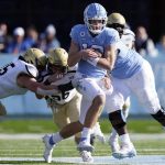 
              North Carolina quarterback Drake Maye (10) runs the ball against Wofford during the second half of an NCAA college football game in Chapel Hill, N.C., Saturday, Nov. 20, 2021. (AP Photo/Gerry Broome)
            