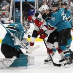 
              San Jose Sharks goaltender James Reimer (47) makes a save with the help of defenseman Mario Ferraro (38) against New Jersey Devils left wing Tomas Tatar (90) during the second period of an NHL hockey game Saturday, Nov. 6, 2021, in San Jose, Calif. (AP Photo/Josie Lepe)
            