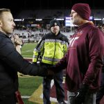 
              Boston College head coach Jeff Hafley, left, shakes hands with Virginia Tech head coach Justin Fuente following an NCAA college football game, Friday, Nov. 5, 2021, in Boston. (AP Photo/Michael Dwyer)
            