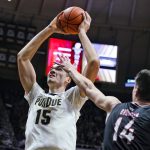 
              Purdue's Zach Edey (15) shoots over Omaha's Dylan Brougham (14) during the second half of an NCAA college basketball game in West Lafayette, Ind., Friday, Nov. 26, 2021. Purdue defeated Omaha 97-40. (AP Photo/Michael Conroy)
            