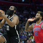 
              Brooklyn Nets guard James Harden (13) attempts a layup as Detroit Pistons forward Saddiq Bey (41) defends during the first half of an NBA basketball game, Friday, Nov. 5, 2021, in Detroit. (AP Photo/Carlos Osorio)
            