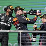 
              Red Bull driver Max Verstappen, center, of the Netherlands, Mercedes driver Lewis Hamilton, left, of Britain, and Red Bull driver Sergio Perez, of Mexico, celebrate following the Formula One U.S. Grand Prix auto race at Circuit of the Americas, Sunday, Oct. 24, 2021, in Austin, Texas. Verstappen won the race, Hamilton finished second and Perez finished third. (AP Photo/Darron Cummings)
            