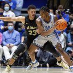 
              Duke's Jeremy Roach (3) is defended by Army's Aaron Duhart (23) during the first half of an NCAA college basketball game in Durham, N.C., Friday, Nov. 12, 2021. (AP Photo/Ben McKeown)
            