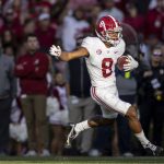 
              Alabama wide receiver John Metchie III (8) gets loose on a pass reception during the first half of an NCAA college football game against Auburn, Saturday, Nov. 27, 2021, in Auburn, Ala. (AP Photo/Vasha Hunt)
            
