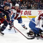 
              Colorado Avalanche goalie Darcy Kuemper, right, stops a shot in front of Columbus Blue Jackets forward Yegor Chinakhov, left, and Avalanche defenseman Samuel Girard during the second period of an NHL hockey game in Columbus, Ohio, Saturday, Nov. 6, 2021. (AP Photo/Paul Vernon)
            