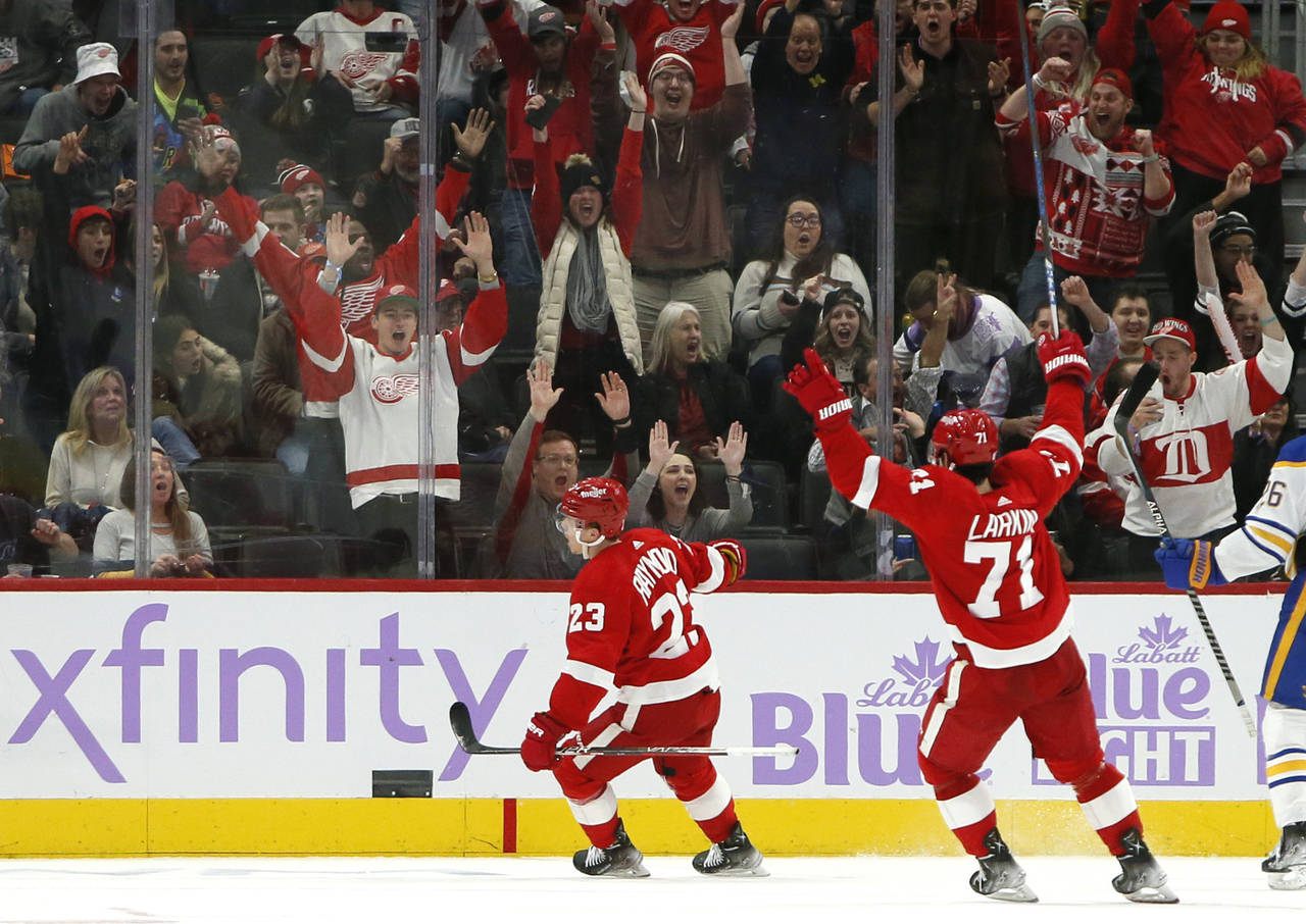Detroit Red Wings right wing Lucas Raymond (23) celebrates his game-winning goal with center Dylan ...