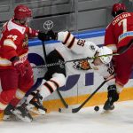 
              Kunlun Red Star's Victor Bartley, left, sends Amur's Radan Lenc, center, down during the Kontinental Hockey League ice hockey match between Kunlun Red Star Beijing and Amur Khabarovsk in Mytishchi, just outside Moscow, Russia, Monday, Nov. 15, 2021. Many of Kunlun Red Star's players are aiming to represent the Chinese national team at the Olympics in Beijing. (AP Photo/Alexander Zemlianichenko)
            