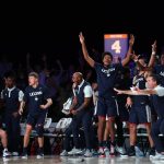 
              The Connecticut bench celebrates a 3-point basket against Auburn during an NCAA college basketball game at Paradise Island, Bahamas, Wednesday, Nov. 24, 2021. (Tim Aylen/Bahamas Visual Services via AP)
            