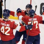 
              Florida Panthers center Eetu Luostarinen, rear, celebrates with defenseman Gustav Forsling (42) and center Frank Vatrano (77) after scoring the winning goal during an overtime period of an NHL hockey game against the Washington Capitals, Thursday, Nov. 4, 2021, in Sunrise, Fla. (AP Photo/Wilfredo Lee)
            