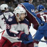 
              Columbus Blue Jackets right wing Oliver Bjorkstrand, front, looks around Colorado Avalanche defenseman Samuel Girard for a pass in the second period of an NHL hockey game Wednesday, Nov. 3, 2021, in Denver. (AP Photo/David Zalubowski)
            