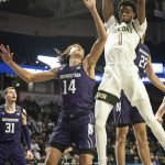 
              Wake Forest forward Isaiah Mucius (1) grabs a rebound over Northwestern guard Casey Simmons (14) in the first half of an NCAA college basketball game on Tuesday, Nov. 30, 2021, at the Joel Coliseum in Winston-Salem, N.C. (Allison Lee Isley/The Winston-Salem Journal via AP)
            