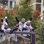 
              Atlanta Braves players celebrate the team's victory during a victory parade, Friday, Nov. 5, 2021, in Atlanta. The Braves beat the Houston Astros 7-0 in Game 6 on Tuesday to win their first World Series baseball title in 26 years. (AP Photo/Brynn Anderson)
            