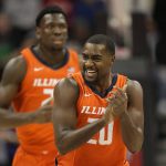 
              Illinois' Da'Monte Williams celebrates after making a basket during the first half of an NCAA college basketball game against Kansas StateTuesday, Nov. 23, 2021, in Kansas City, Mo. (AP Photo/Charlie Riedel)
            
