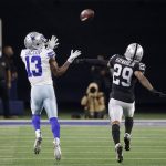 
              Dallas Cowboys wide receiver Michael Gallup (13) reaches up to catch a long pass as Las Vegas Raiders cornerback Casey Hayward Jr. (29) defends in the second half of an NFL football game in Arlington, Texas, Thursday, Nov. 25, 2021. (AP Photo/Michael Ainsworth)
            