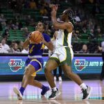 
              Morehead State guard Morgan Browning (4) drives to the basket as Baylor guard Jordan Lewis (3) defends during the first half of an NCAA college basketball game in Waco, Texas, Tuesday, Nov. 30, 2021. (AP Photo/Tony Gutierrez)
            