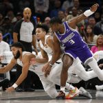 
              Oklahoma City Thunder forward Kenrich Williams (34) and guard Tre Mann (23) fight for the ball with Sacramento Kings guard Terence Davis (3) during the second half of an NBA basketball game, Friday, Nov. 12, 2021, in Oklahoma City. (AP Photo/Garett Fisbeck)
            