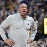 
              Philadelphia 76ers coach Doc Rivers watches during the first half of the team's NBA basketball game against the Utah Jazz on Tuesday, Nov. 16, 2021, in Salt Lake City. (AP Photo/Rick Bowmer)
            