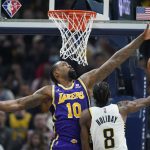
              Indiana Pacers' Justin Holiday (8) shoots against Los Angeles Lakers' DeAndre Jordan (10) during the first half of an NBA basketball game Wednesday, Nov. 24, 2021, in Indianapolis. (AP Photo/Darron Cummings)
            