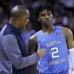 
              North Carolina coach Hubert Davis talks to Caleb Love (2) during the team's NCAA basketball game against College of Charleston, during the second half Tuesday, Nov. 16, 2021, in Charleston, S.C. (AP Photo/Mic Smith)
            