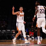 
              Phoenix Suns guard Devin Booker (1) reacts during the second half of an NBA basketball game against the Brooklyn Nets, Saturday, Nov. 27, 2021, in New York. (AP Photo/Jessie Alcheh)
            