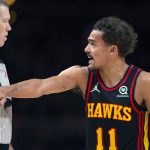 
              Atlanta Hawks guard Trae Young (11) talks with an official during the second half of an NBA basketball game against the New York Knicks Saturday, Nov. 27, 2021, in Atlanta. (AP Photo/Hakim Wright Sr.)
            