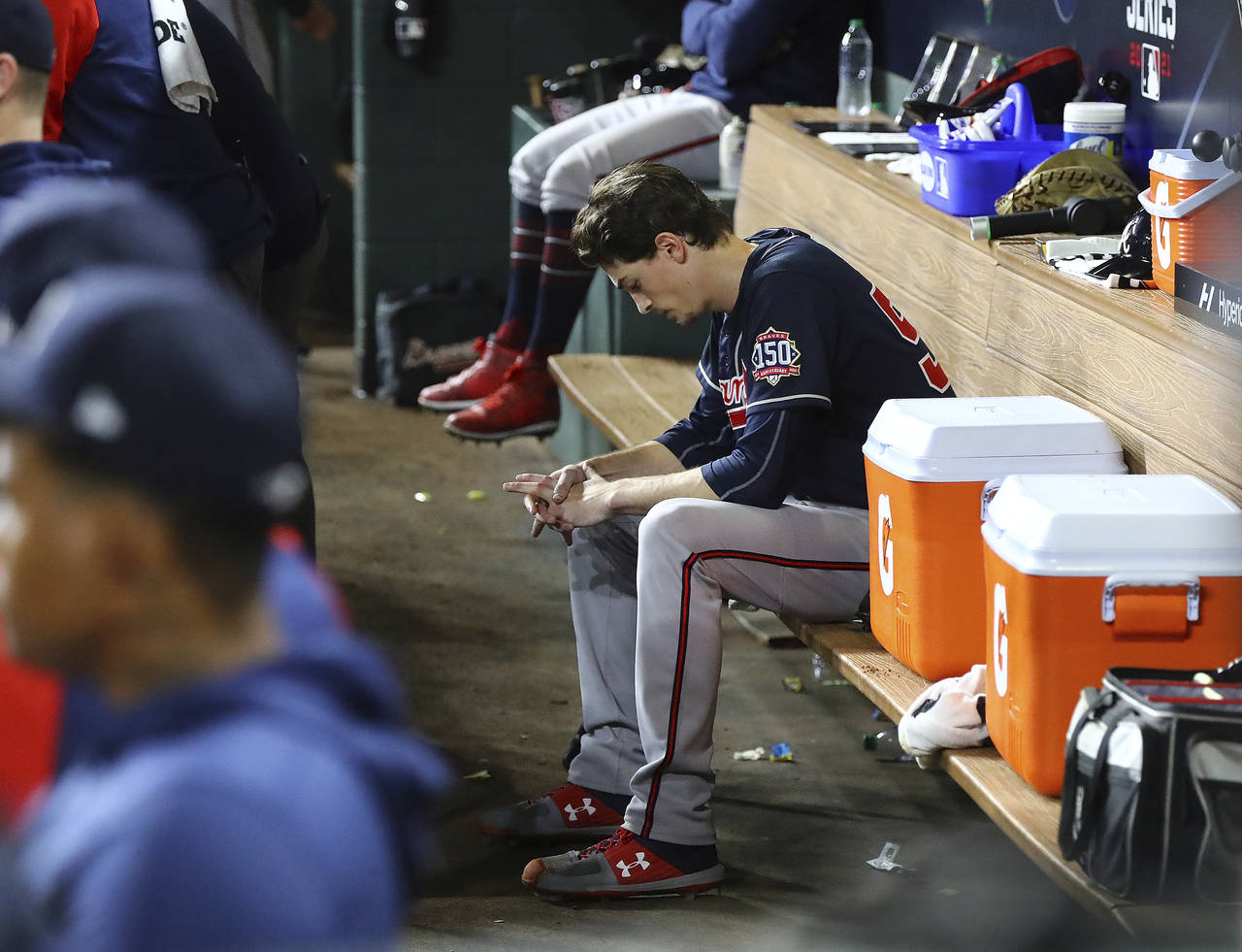 Braves starter Max Fried sits dejected in the dugout during the 6th inning of a 7-2 loss to the Ast...