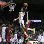 
              Baylor guard Kendall Brown (2) dunks past Incarnate Word guard Drew Lutz (3) in the second half of an NCAA college basketball game, Friday, Nov. 12, 2021, in Waco, Texas. (AP Photo/Jerry Larson)
            