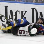 
              St. Louis Blues' Ryan O'Reilly (90) and Arizona Coyotes' Dysin Mayo (61) fall to the ice during the third period of an NHL hockey game Tuesday, Nov. 16, 2021 in St. Louis. The Coyotes won 3-2. (AP Photo/Tom Gannam)
            