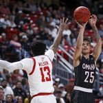 
              Omaha's Felix Lemetti (25) shoots over Texas Tech's Mylik Wilson (13) during the first half of an NCAA college basketball game Tuesday, Nov. 23, 2021, in Lubbock, Texas. (Brad Tollefson/Lubbock Avalanche-Journal via AP)
            